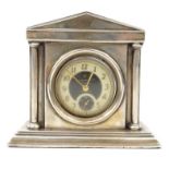 Silver mahogany watch stand with an Ingersoll pocket watch, indistinct Birmingham hallmarks, 9cm