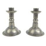 Pair of Arts and Crafts hammered pewter candlesticks, impressed 'JHG' to base, 12cm high : For