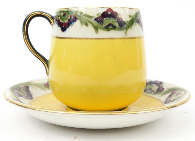 Moorcroft McIntyre cup and saucer : For Condition Reports please visit www.eastbourneauction.com