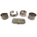 Silver and white metal items comprising two silver napkin rings, white metal bracelet and napkin