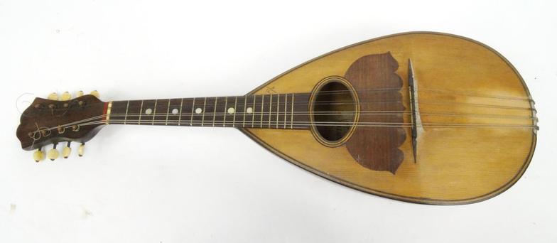 Old wooden mandolin, bearing a Stridente Napoli paper label 'Fabrica di Mandolini Via Antonio, 22' :