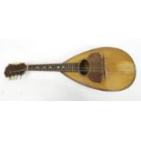 Old wooden mandolin, bearing a Stridente Napoli paper label 'Fabrica di Mandolini Via Antonio, 22' :