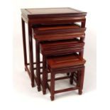 Nest of four oriental hardwood occasional tables, the largest 66cm high : For Condition Reports