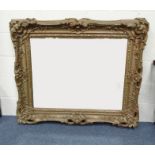 Large ornate gilt wood bevel edged mirror, 125cm long x 104cm high : For Condition Reports please