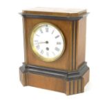 Victorian mantel clock with walnut and ebonised case, enamel dial with black Roman numerals and