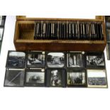 Three wooden cased boxes of black and white slides including Italian scenes, Palestine and some