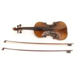 Old wooden violin - Antonio Stradivarius label to interior, together with two bows, the violin