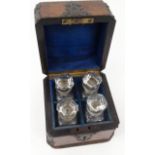 Victorian walnut lady's perfume bottle box with brass strapping housing three cut glass perfume