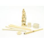 Oriental carved ivory items comprising a figure, two pairs of glove stretchers, cheroot, brooch