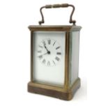Brass carriage clock with enamelled dial, glass sides and bevelled glass panels, 14cm high excluding