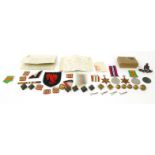 Military interest World War II medal group buttons and badges for Captain P.A. Wright, together with
