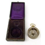 Brass air meter with silvered scale, housed in a velvet lined box, stamped '98', 5cm diameter :