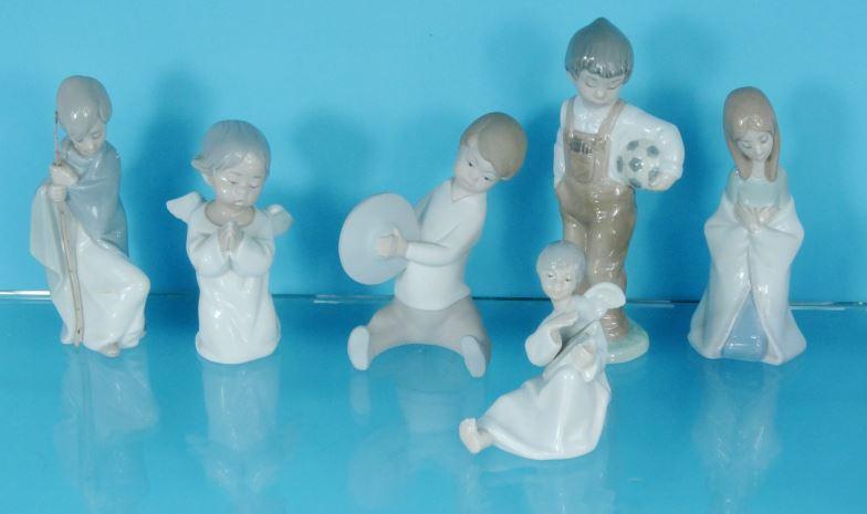 Four Lladro China figures and two Nao figures, the largest 18.5cm high : For Condition Reports