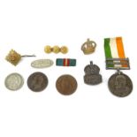 Military interest South Africa medal for PTE.B.P.M.ROBINSON, together with a selection of badges