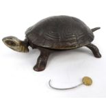 Cast iron tortoise table bell with beaded glass eyes, 18cm long : For Condition Reports please visit