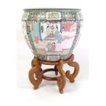 Large oriental porcelain jardinières enamelled with flowers and figures in domestic scenes and