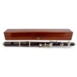Boxed Boosey & Co rosewood flute housed in a mahogany box, stamped 'Boosey & Co Makers, 295 Regent