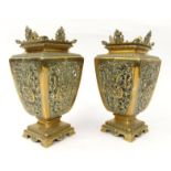 Pair of pierced Arts and crafts brass vases decorated with lyres and cherubs' heads, registered