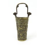 Antique style Continental bronze pot with swing handle decorated with heads and shields, 22cm high :