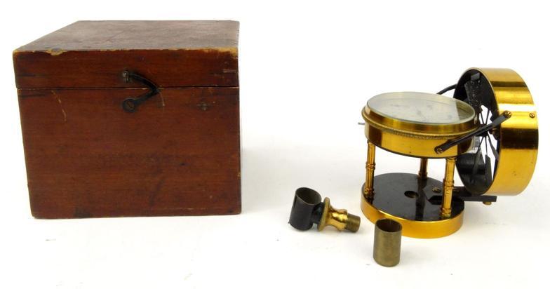 Brass air meter, number 1043, with silvered dial, housed in a wooden box, 9cm high : For Condition