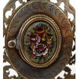 Ornate Victorian pierced brass locket photo frame with floral micromosaic opening front panel,