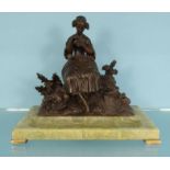 Bronzed model of a girl seated on a rock (Forget-Me-Not), pen tray on a green marble base, 24cm high
