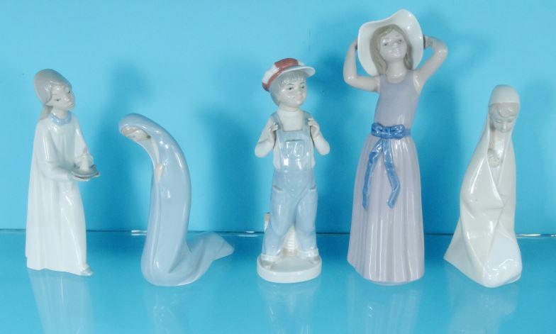 Five Lladro China figures, the largest 26cm high : For Condition Reports please visit www.