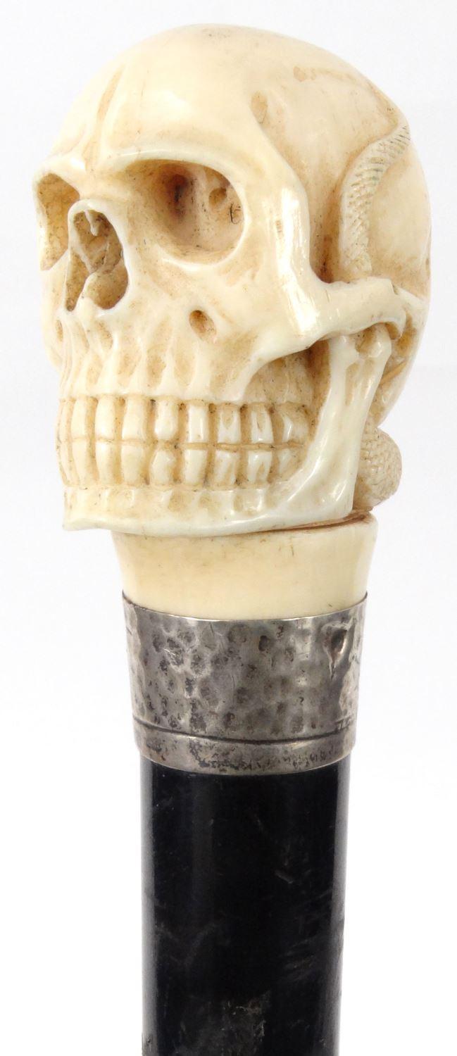 Carved ivory skull head and snake walking stick, 93cm long : For Condition Reports please visit