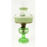 Green glass oil lamp with floral glass shade : For Condition Reports please visit www.