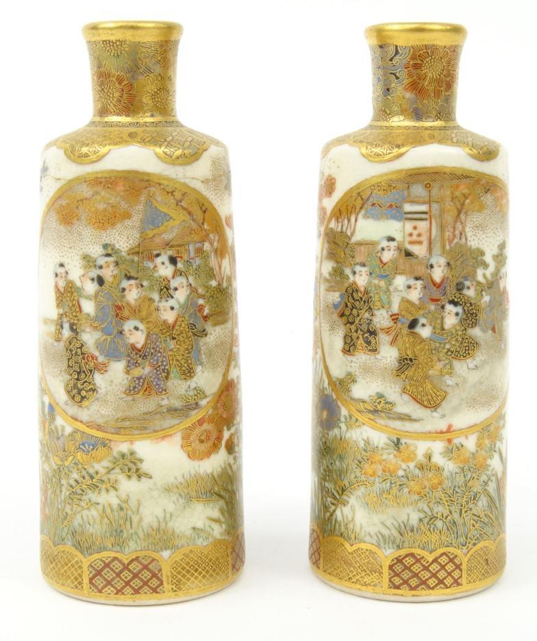 Pair of oriental Japanese Satsuma Pottery vases, finely hand painted with flowers and scenes,