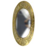 Oval brass Arts and Crafts mirror with Celtic design, 82cm long : For Condition Reports please visit