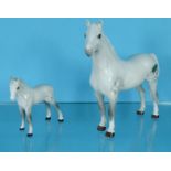 Two white Beswick China horses, the larger 15.5cm high : For Condition Reports please visit www.
