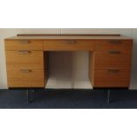John and Sylvia Rhead Stag Fine Line desk fitted with seven drawers, 127cm long x 72cm high x 46.5cm