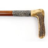 Horn handled Malacca cane riding whip with unmarked silver floral collar, 64cm long : For