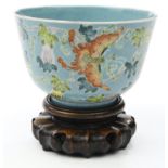 Oriental porcelain footed bowl, enamelled with butterflies and flowers onto a turquoise ground,