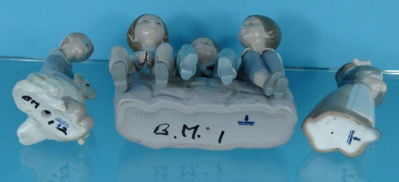 Three boxed Lladro China figures - one of three young figures seated, a girl with a pig and a boy - Image 3 of 4