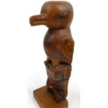 Carved wooden tribal bird with hand painted decoration - The Basic Kwakiutl Design from the
