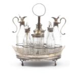 George III silver cruet stand with eight cut glass condiments, etc, predominantly Birmingham 1773