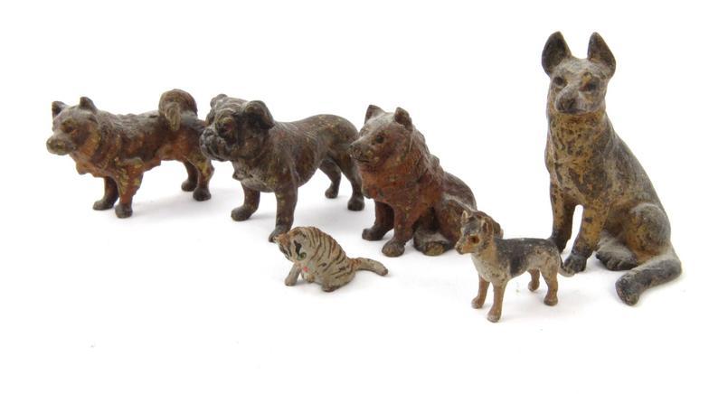 Six miniature cold painted bronze animals including a bulldog, husky and an Alsatian, the largest