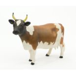 Beswick C.H. Ickham Bessie 198 Ayrshire cow, factory mark to the underside, 10cm high : For