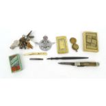 Bag of objects including Civil Service Motoring Association car badge, sovereign case, playing