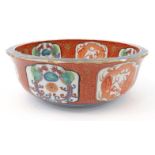 Oriental Imari patterned porcelain bowl hand painted with panels of dragons and birds, the centre