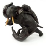 Large bronze oriental Elephant and tiger group, character marks to belly, 28cm high : For