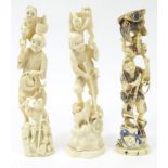 Three oriental carved ivory figures of gentleman with boys, monkeys and birds, the largest 18cm high