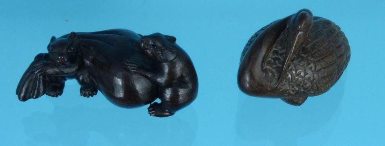 Two oriental carved wooden Netsukes - one of rats, the other of a bird, the larger 5.5cm long :