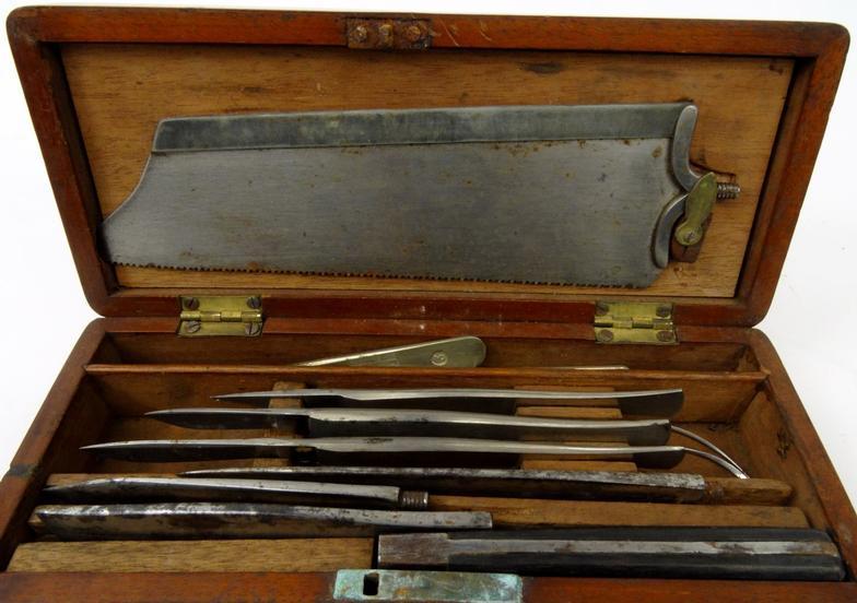 Selection of surgeon's tools including a saw, scalpel, knives and hooks, housed in a mahogany box, - Image 2 of 3