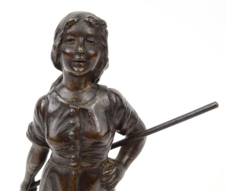 Bronze figure of a Dutch peasant girl, 18cm high : For Condition Reports please visit www.