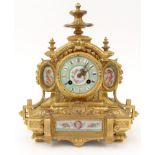 French ormolu mantel clock hand painted with porcelain panels of cherubs and floral dial, striking