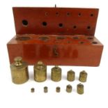 Wooden boxed set of brass scale weights, the largest 4cm high : For Condition reports please visit