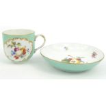 Meissen porcelain cup and saucer hand painted with fruit, blue crossed swords mark to base, the